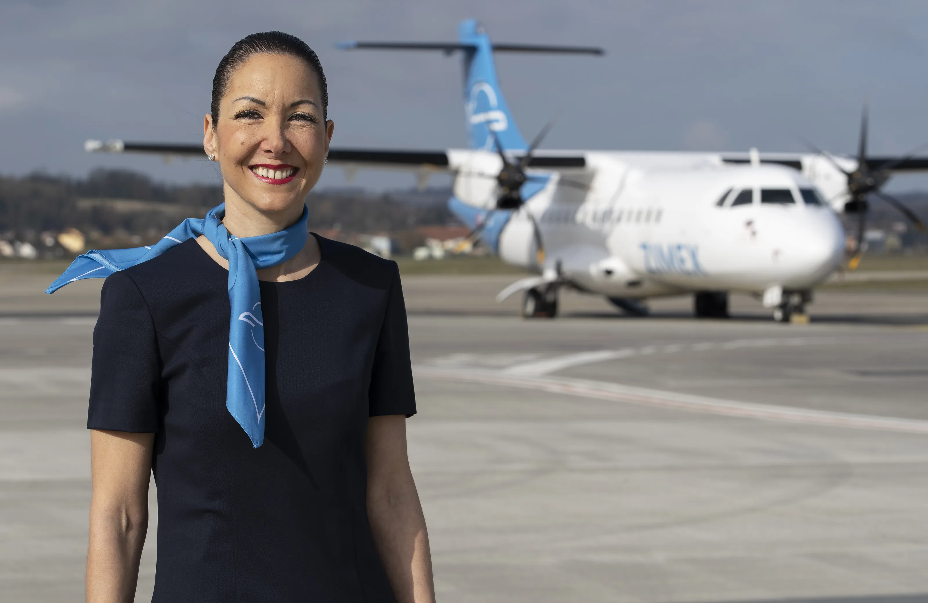 Zimex cabin crew in front of the ATR 42