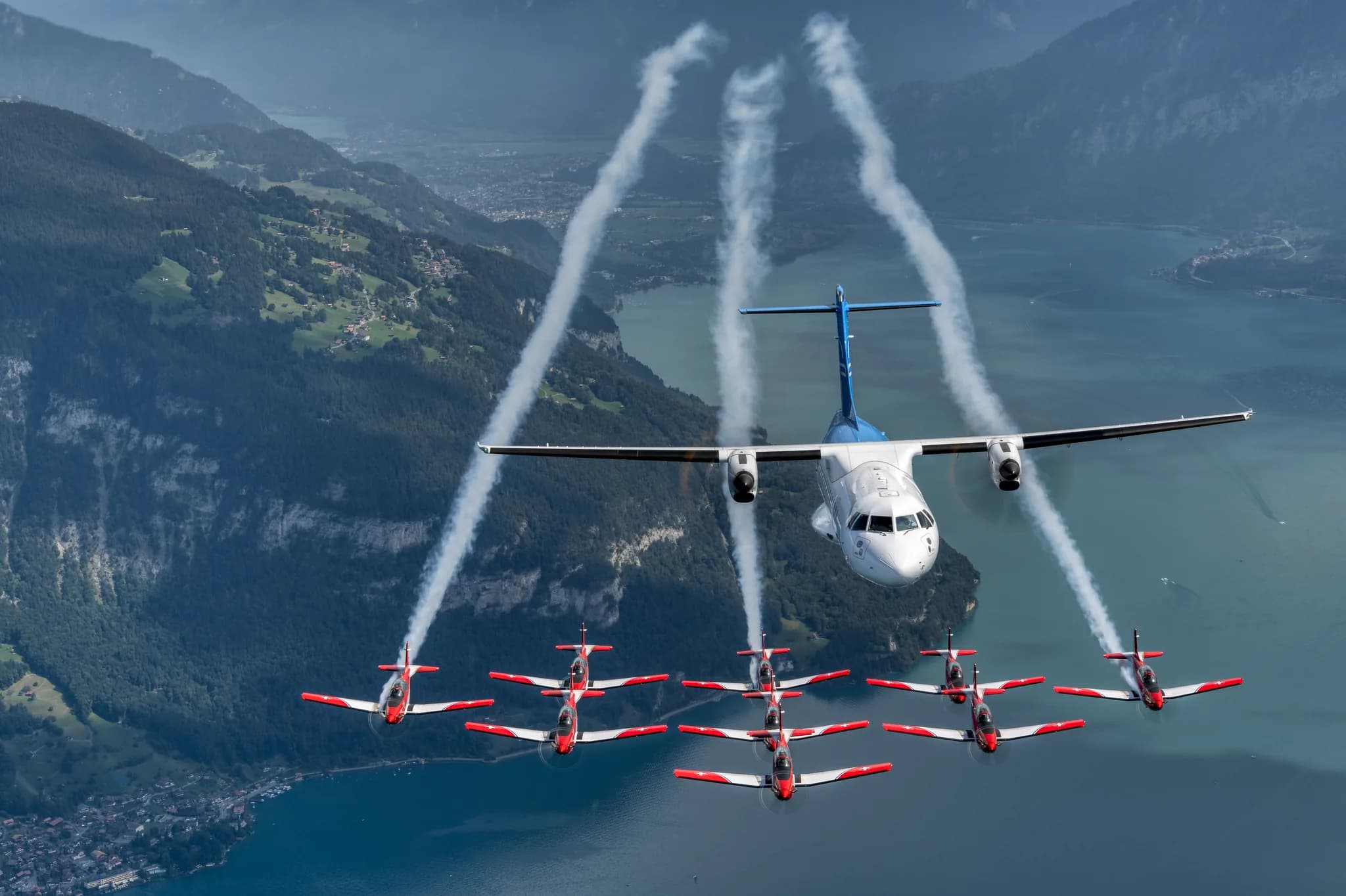 HB-ALN in formation with the Swiss Air Force PC-7 Team