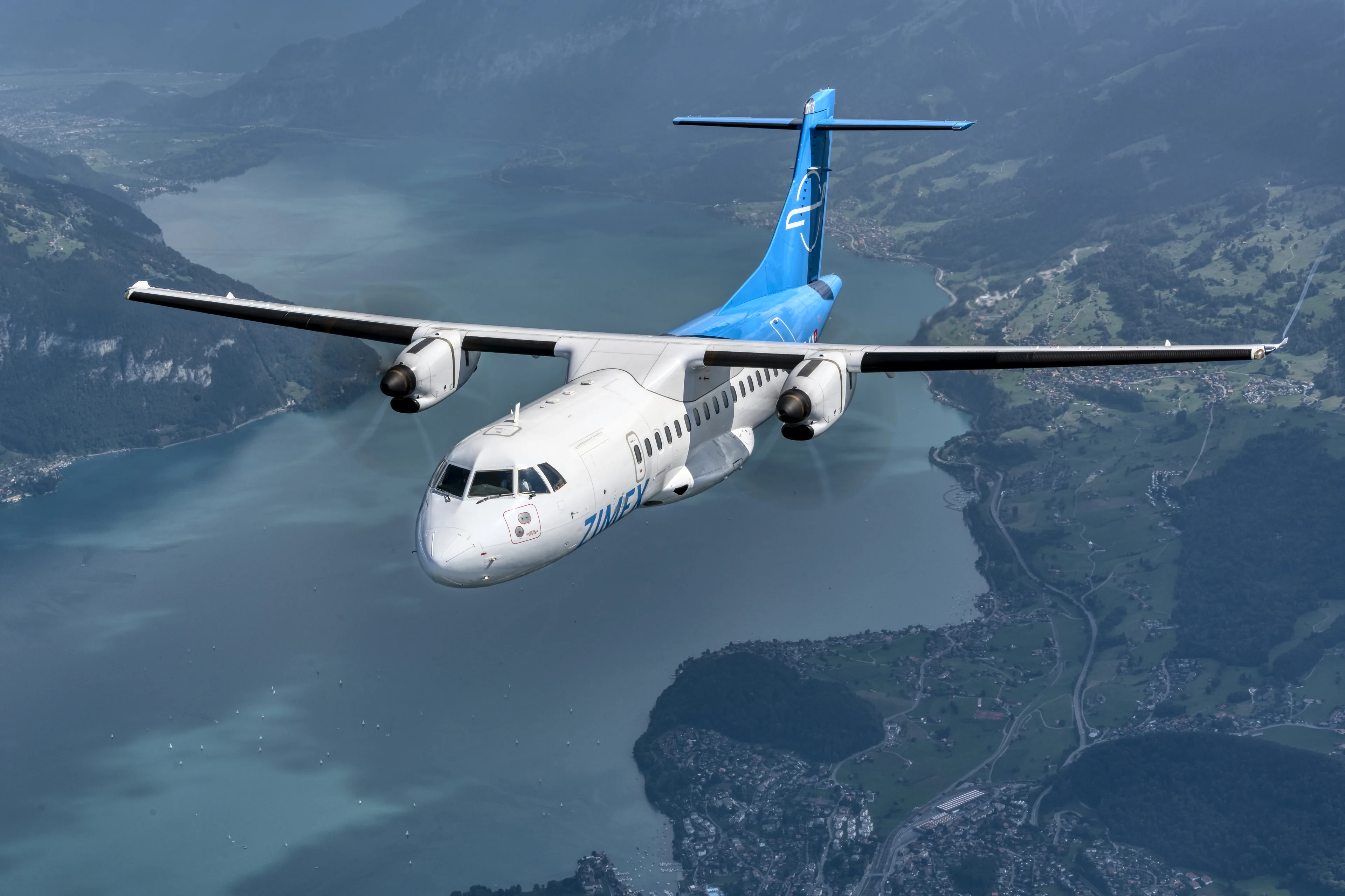 The Zimex ATR 42-500 HB-ALN over Lake Thun