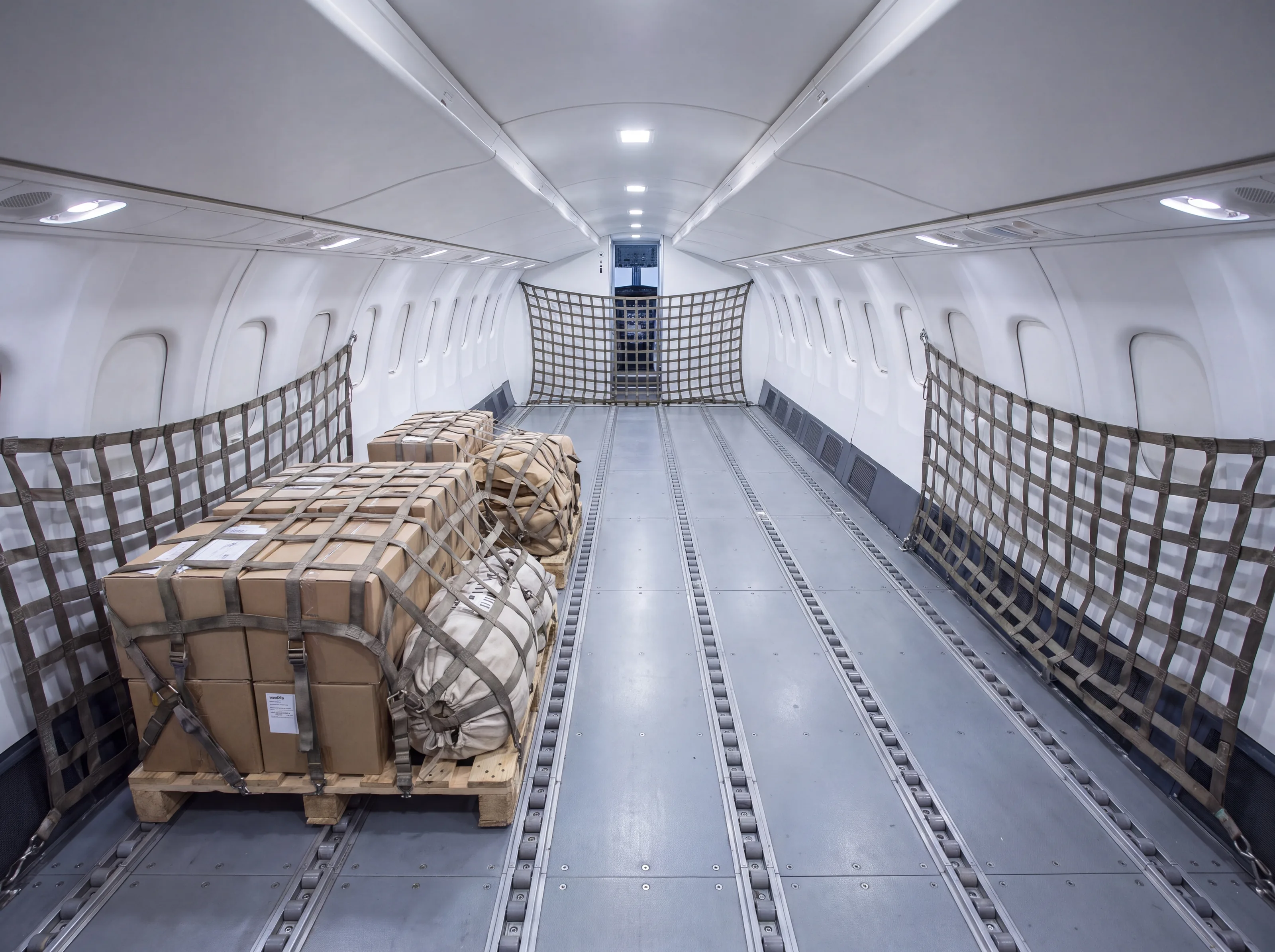 ATR 72 freighter main deck with cargo nets (AI-generated illustration)