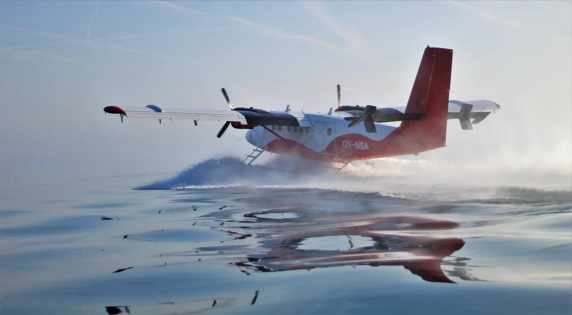 A Twin Otter on floats taking off from the water