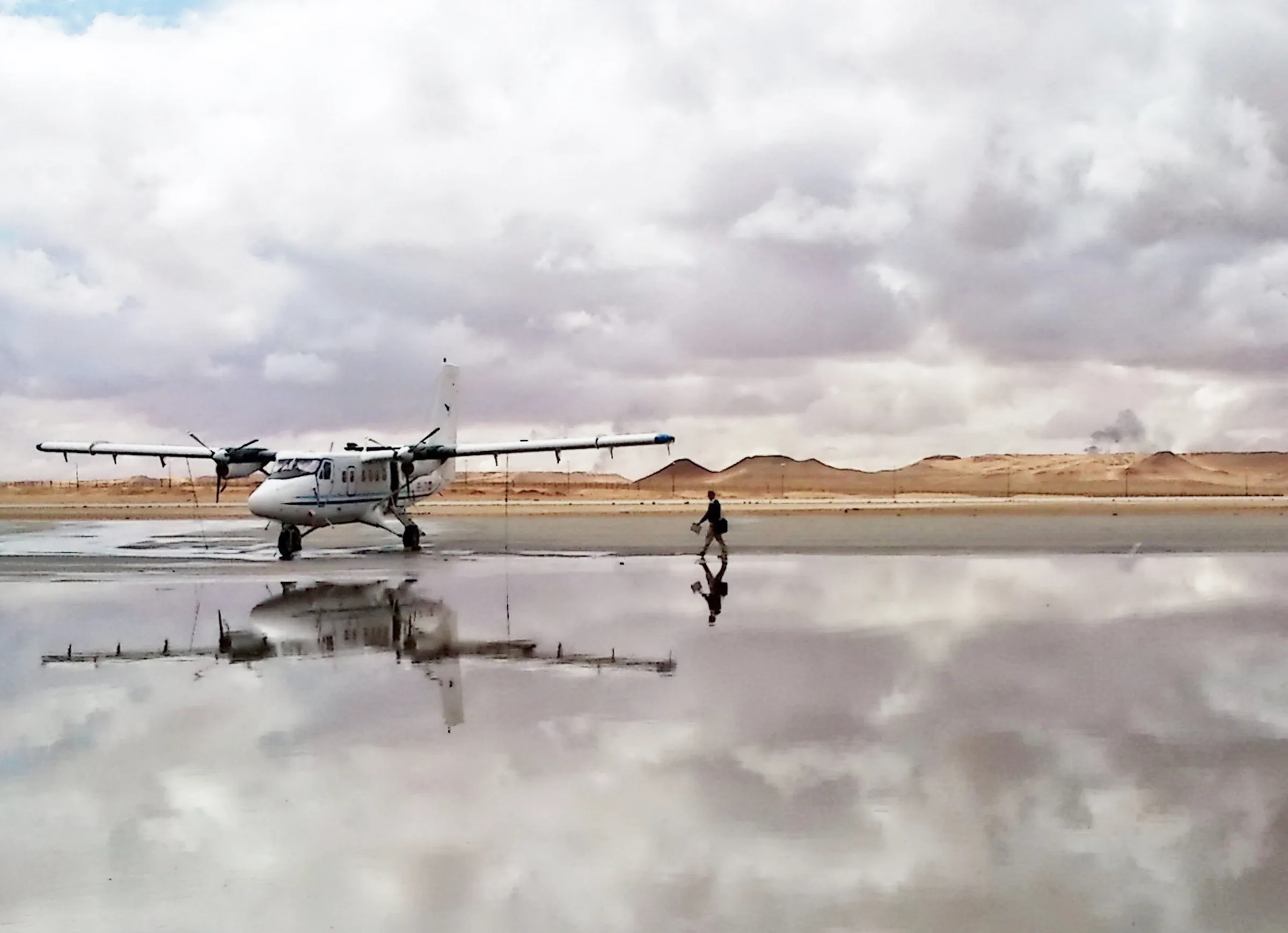 Twin Otter reflected in water