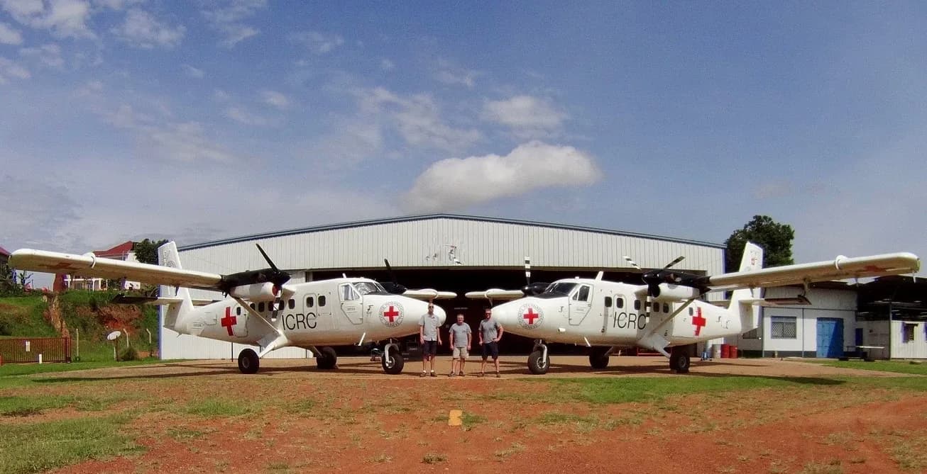 Two ICRC Twin Otters outside the hangar at Kajjansi, Uganda