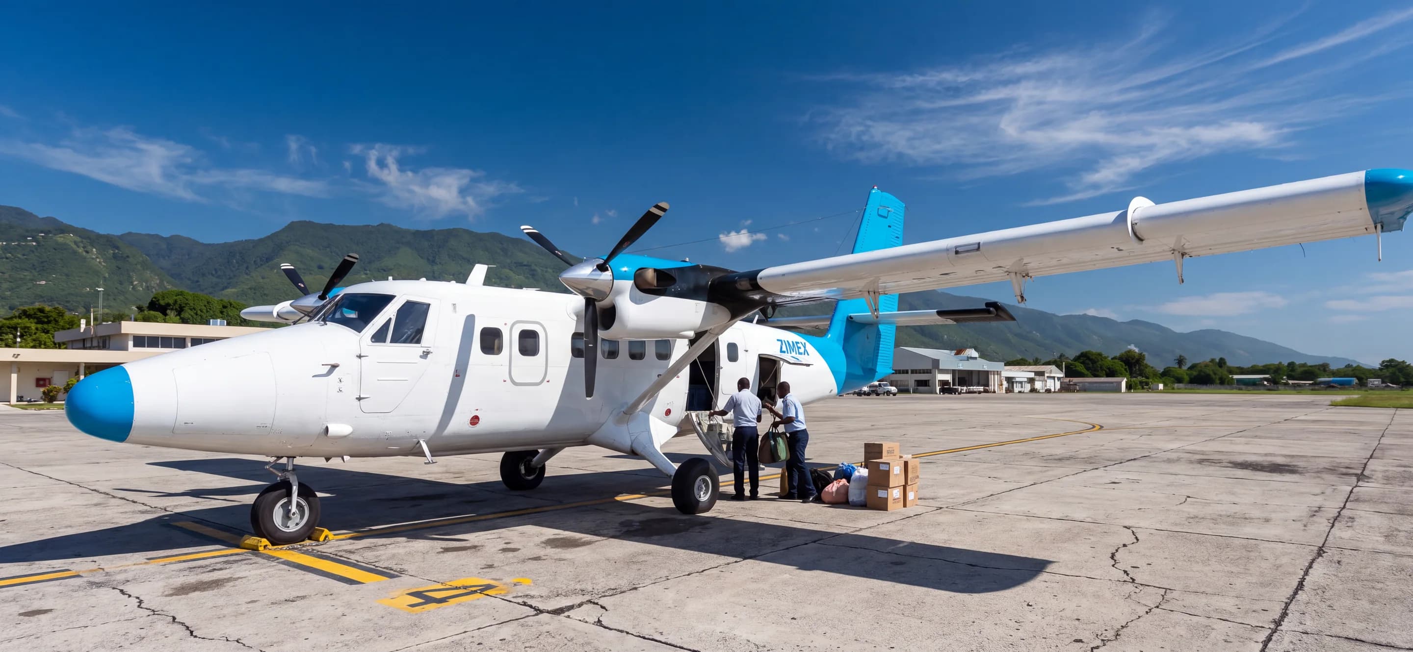 UN Humanitarian Air Service Twin Otter being loaded on the apron in Haiti