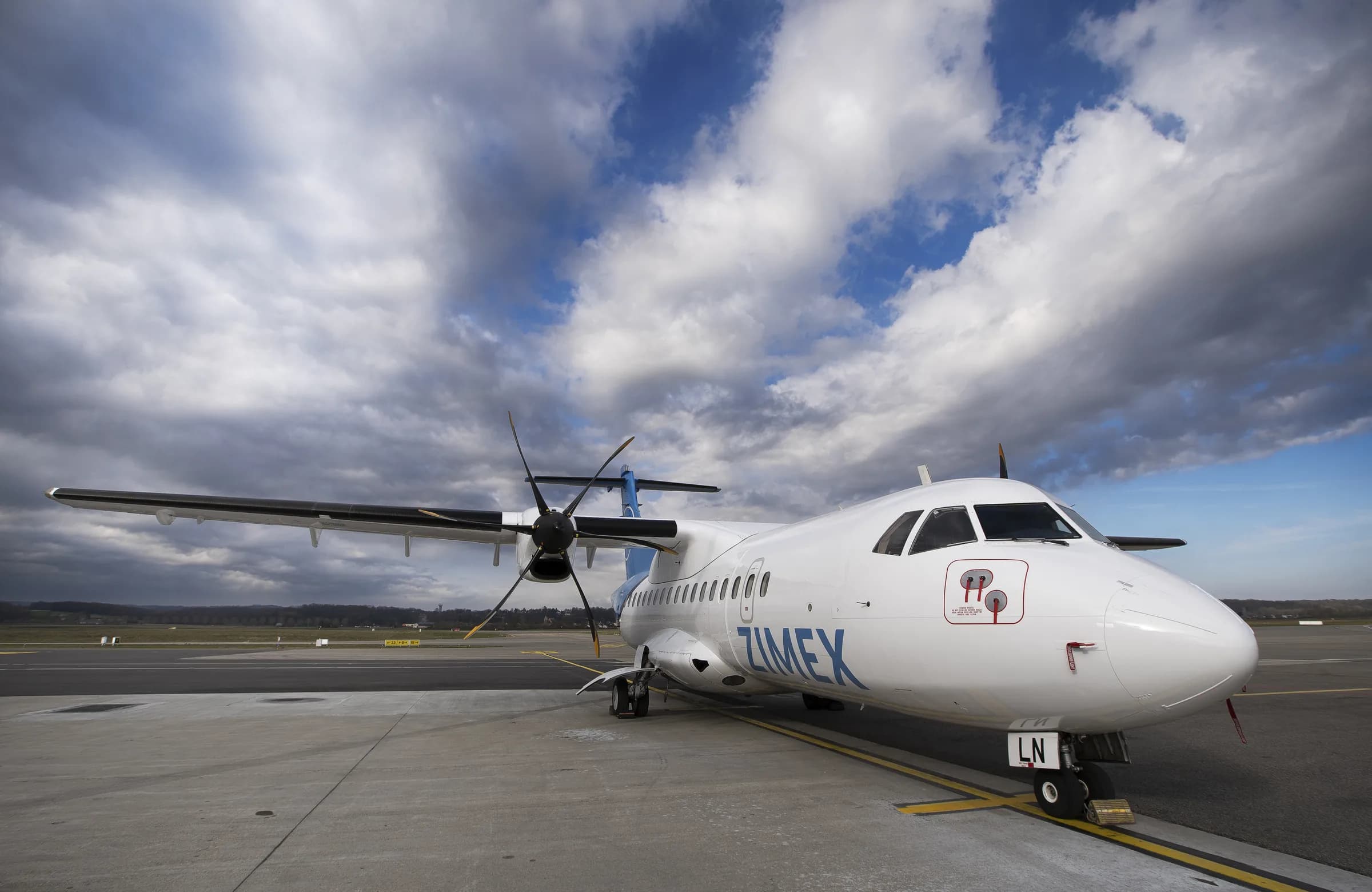 A Zimex ATR 42 on the apron under a big sky.
